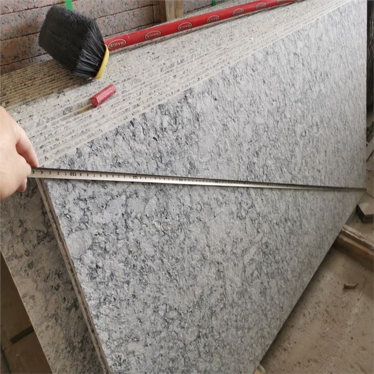 white wave granite kitchen